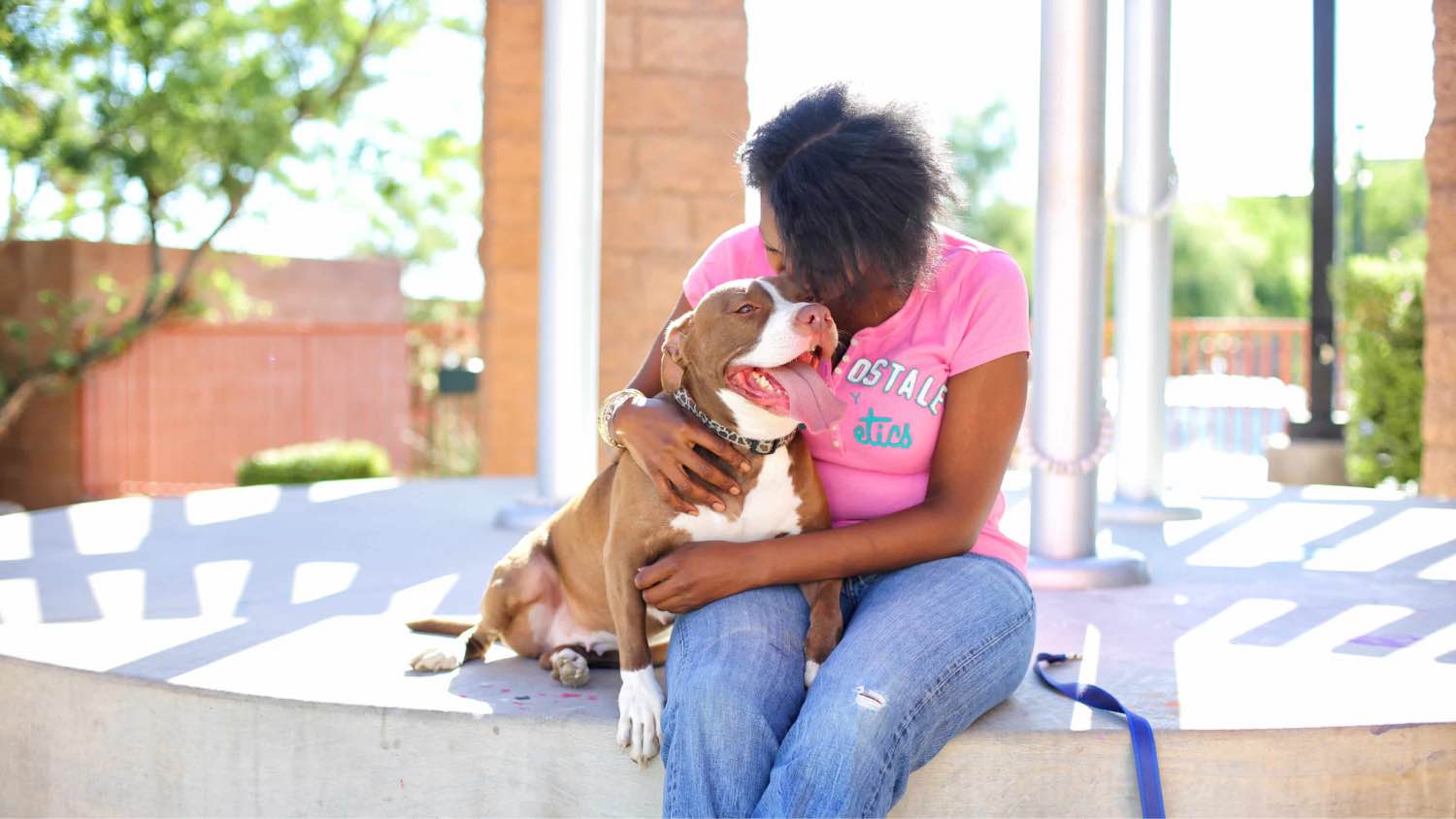 Hugging her dog